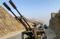 a taliban security personnel operating an anti aircraft gun keeps watch for pakistani airstrikes near the torkham border crossing between afghanistan and pakistan in the nangarhar province on february 27 2026 photo afp