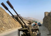 a taliban security personnel operating an anti aircraft gun keeps watch for pakistani airstrikes near the torkham border crossing between afghanistan and pakistan in the nangarhar province on february 27 2026 photo afp
