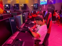 boys look at their mobile phones at a gaming centre after the united arab emirates approved a resolution setting the minimum age for social media use at 15 in dubai united arab emirates june 18 2026 photo reuters