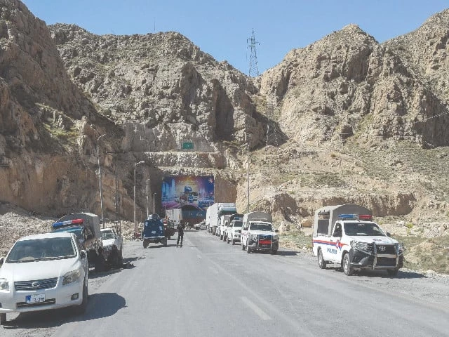 police vehicles are parked outside the lakpass tunnel as authorities block the entrance with shipping containers during a sit in protest by the bnp m on the outskirts of quetta photo afp police vehicles are parked outside the lakpass tunnel as authorities block the entrance with shipping containers during a sit in protest by the bnp m on the outskirts of quetta photo afp