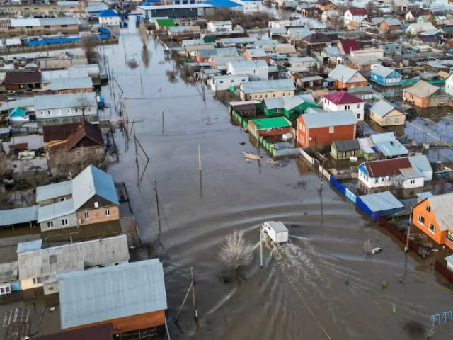 a drone view shows a truck driving along the flooded street in the settlement of zarechnoye orenburg region russia april 11 2024 photo reuters a drone view shows a truck driving along the flooded street in the settlement of zarechnoye orenburg region russia april 11 2024 photo reuters