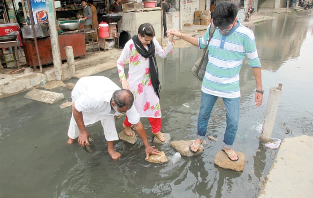 Much to everyone's disappointment the 33mm rainfall also caused chaos in the city. PHOTO: ATHAR KHAN/EXPRESS