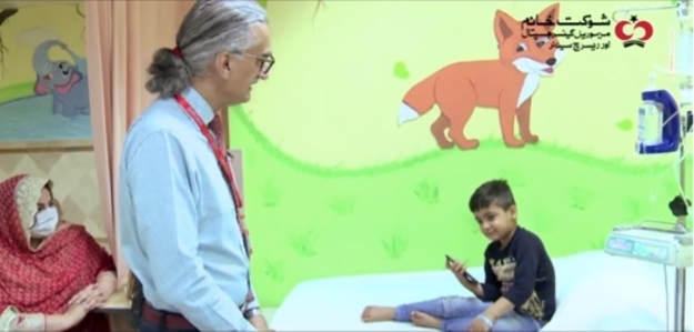In the picture, a young, courageous boy, Muhammad Noor can be seen talking to Dr Aasim Yusuf while getting prepped to receive chemotherapy in the Chemotherapy Bay