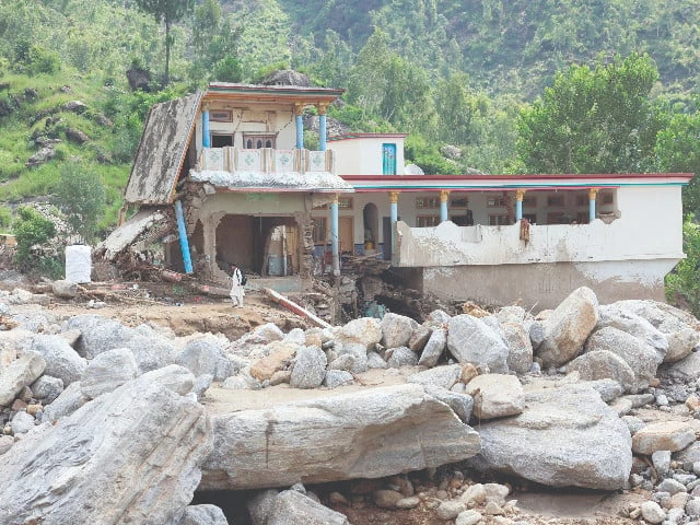 a man stands close to a house severely damaged by devastating floods in the mountainous qadir nagar village of buner district khyber pakhtunkhwa province photo reuters a man stands close to a house severely damaged by devastating floods in the mountainous qadir nagar village of buner district khyber pakhtunkhwa province photo reuters