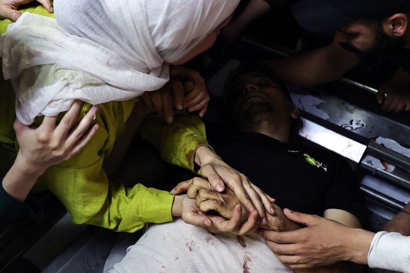 the sister of mutaz khaled sadiq nabulsi 28 years old says her final farewells at the morgue of the rafidia hospital hours after he was killed during an israeli raid on the balata refugee camp near the israeli occupied west bank city of nablus on june 3 2024 palestinian officials said israeli forces shot dead two palestinians in the occupied west bank on june 3 as israeli police confirmed undercover agents had killed a wanted man in the territory the palestinian health ministry in ramallah named the dead men as adam salahuddin mansour faraj 23 and mutaz khaled sadiq nabulsi 28 photo afp