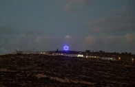 an illuminated star of david above an israeli settlers outpost near ramallah in the israeli occupied west bank august 14 2026 reuters