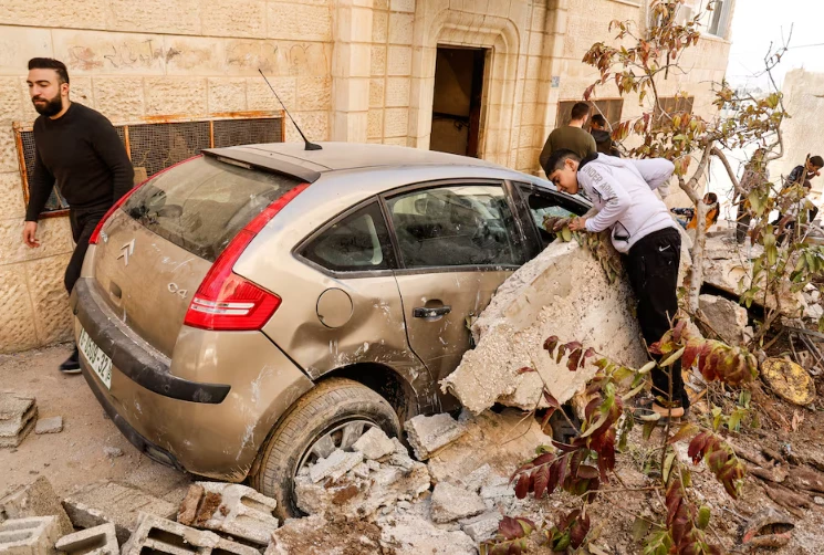 palestinians stand near a damaged vehicle near the site where a number of palestinians were killed in an israeli raid in jenin in the israeli occupied west bank march 11 2025 photo reuters palestinians stand near a damaged vehicle near the site where a number of palestinians were killed in an israeli raid in jenin in the israeli occupied west bank march 11 2025 photo reuters