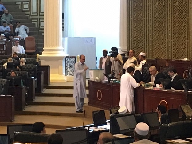 The opposition's nominee for speaker, Laiq Mohammad Khan polling his vote. PHOTO:EXPRESS