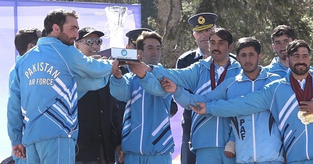 Pakistani women skiers led by Khushim Sahiba performing Formation Display during the prize distribution ceremony of International ski championships at Malam Jabba. PHOTO: APP