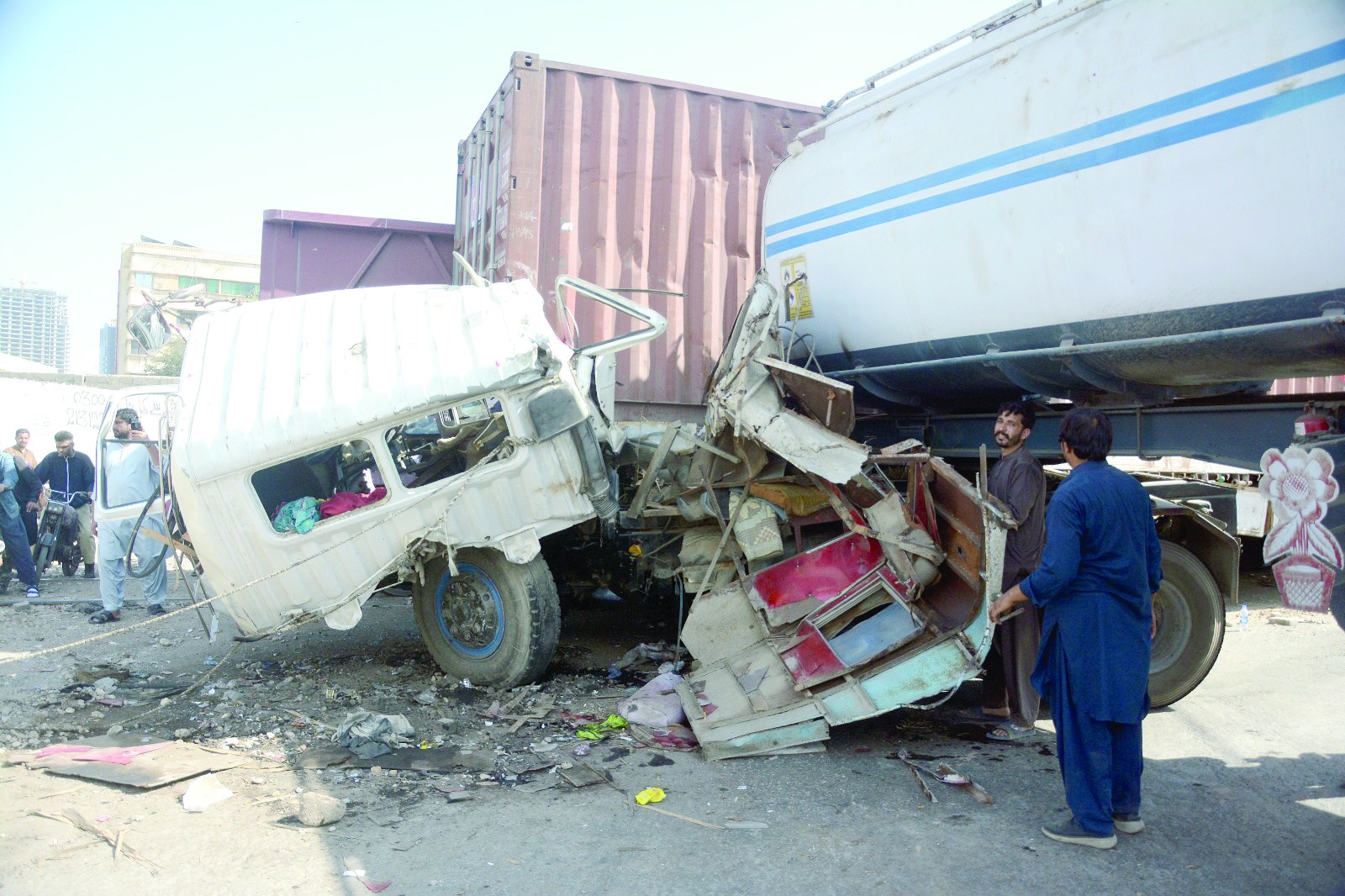 a devastating collision between a freight train and an oil tanker on mai kolachi road brings the city to a standstill with the road remaining closed 18 hours after the crash photo jalal qureshi express