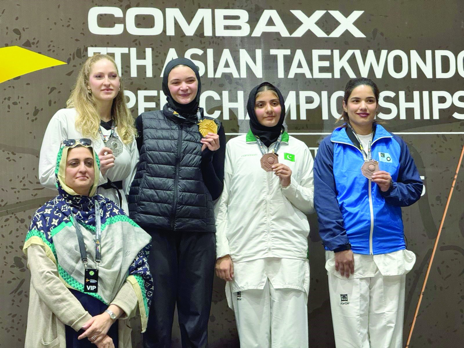 female taekwondo players seen in a group photo on day five of the combaxx 7th asian taekwondo open photo app