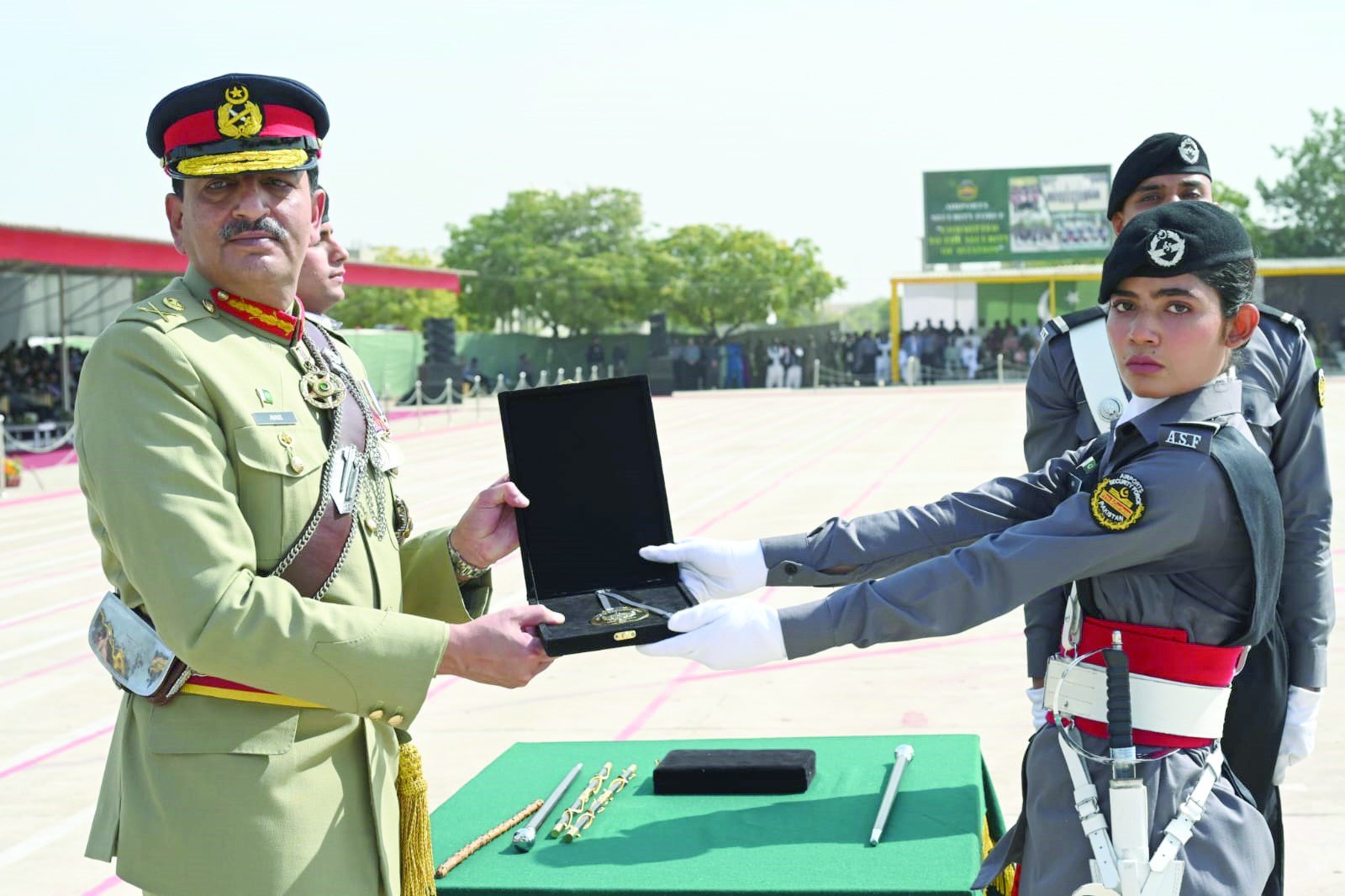 corps commander lt gen mohammad avais dastgir gives a medal to a passing out trainee photo express