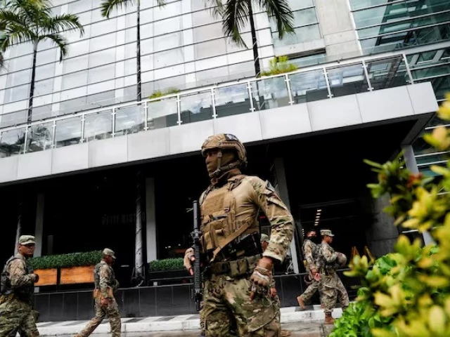members of panama s national aeronaval service police senan stand outside the hotel where migrants from asia and the middle east are housed after being deported to panama as part of an agreement between the administration of us president donald trump and the central american nation in panama city panama on february 18 2025 photo reuters