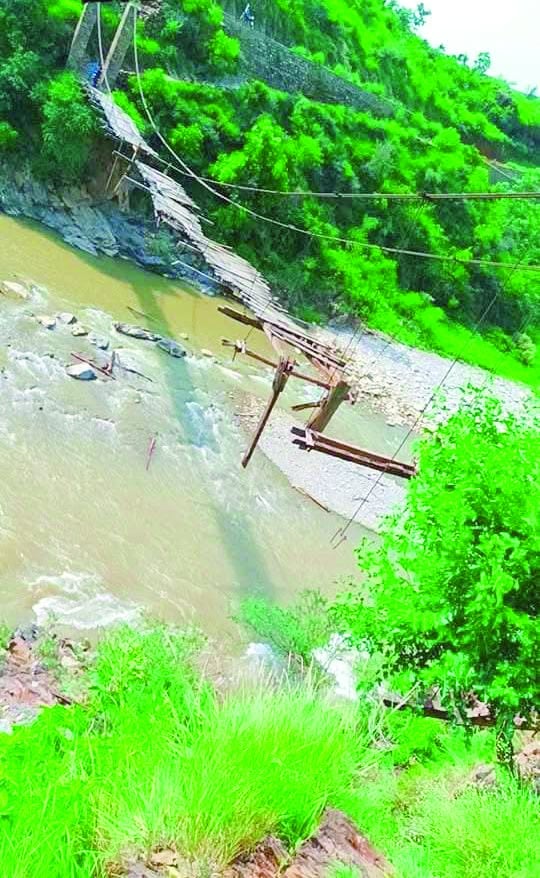 villagers including schoolchildren rely on the decades old wooden bridge for their daily commute to nearby villages the bridge serves as the sole passageway for thousands of residents from kharn kani kot phudrah and neighbouring villages photos express