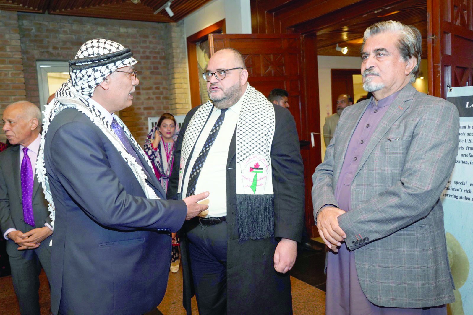 ambassador of palestine to pakistan dr zuhair mohammad hamadallah zaid stands next to other visitors at the inauguration of the palestine was and will remain photography exhibition held at the pnca in a show of solidarity with the palestinian people photo express