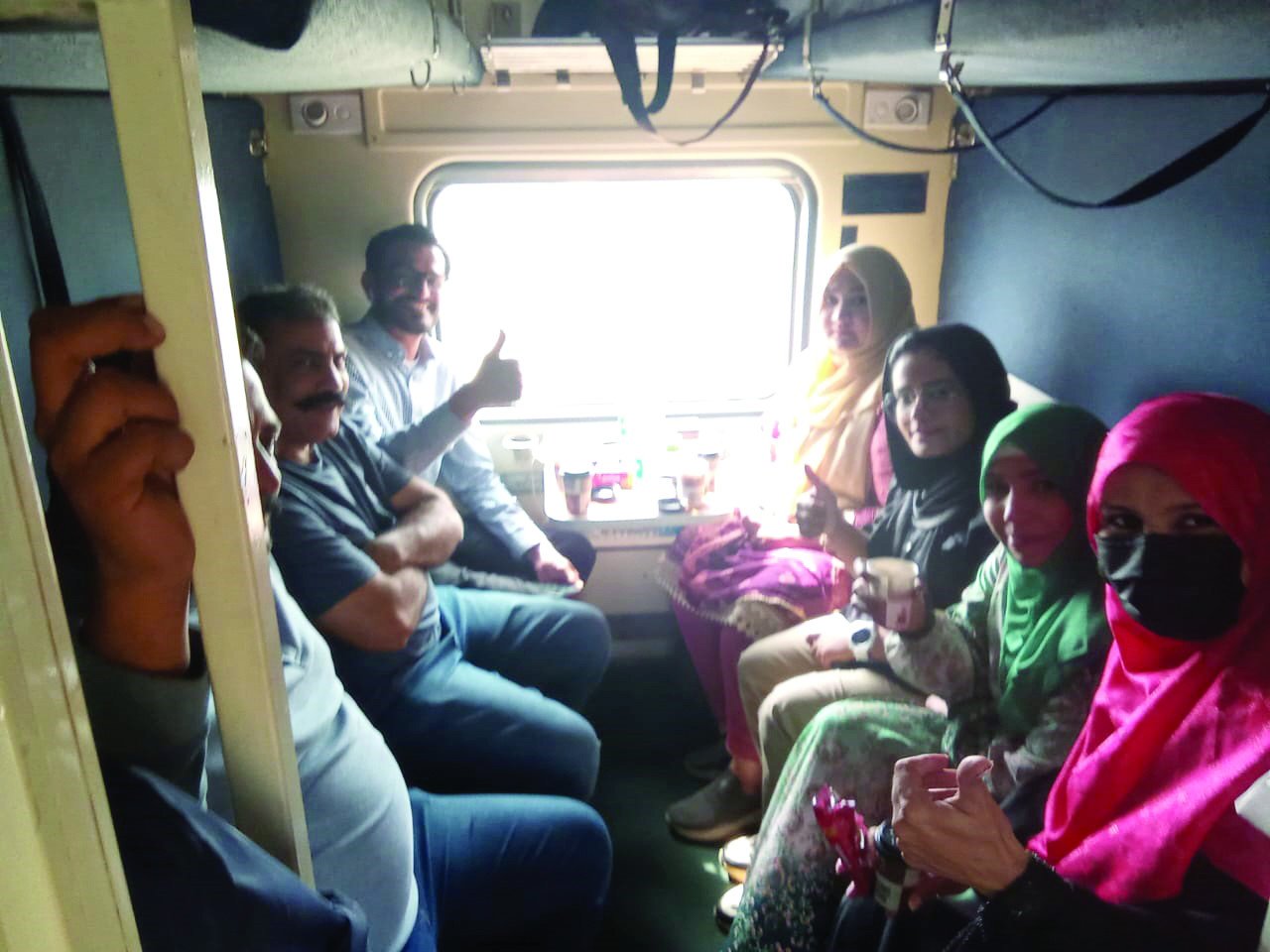 travellers give thumbs up as thar desert safari train chugs off to khokhrapar the last station before the indian border photo express