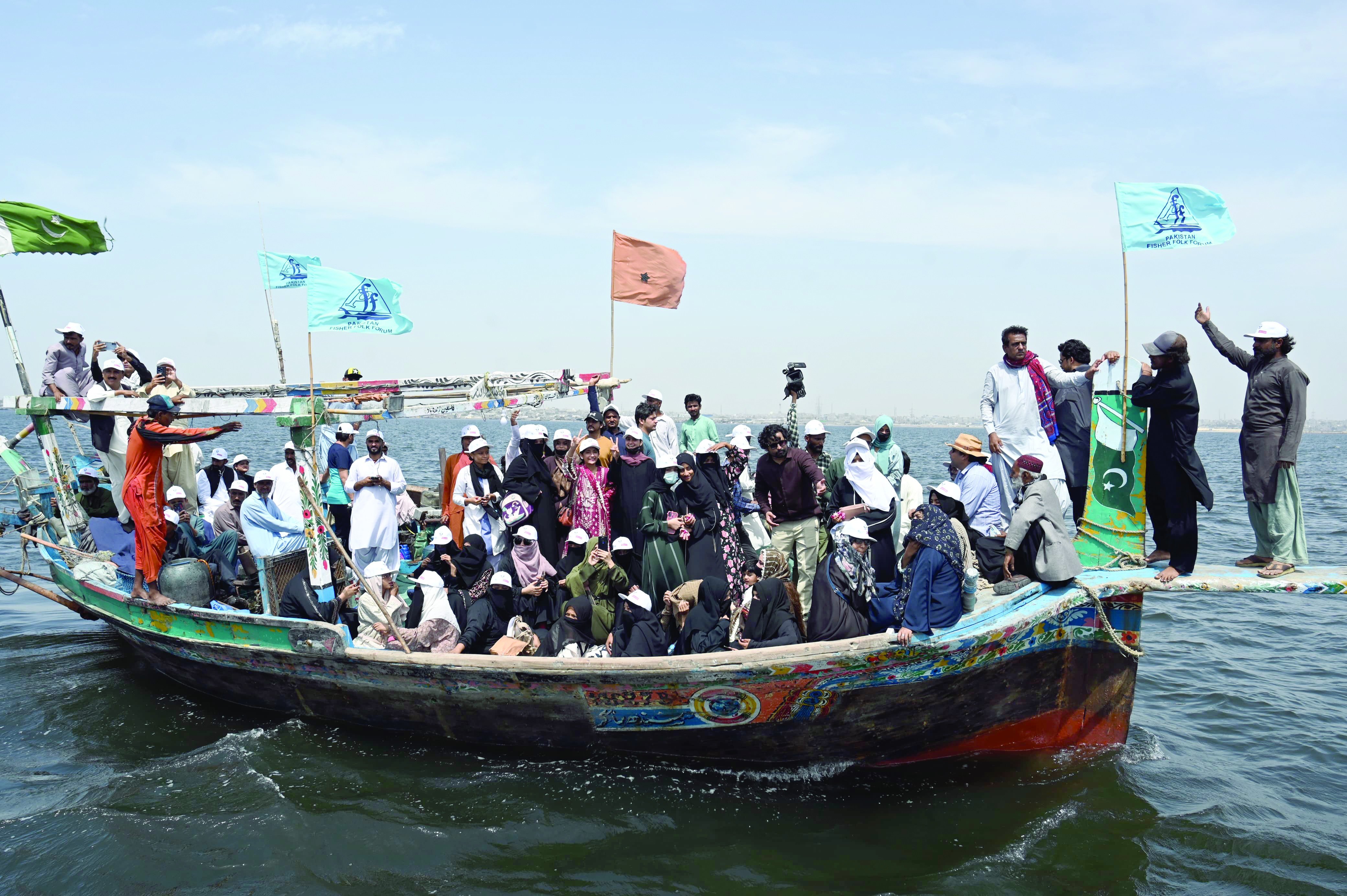 fisherfolk forum activists stage a protest on a boat against the proposed new canals on the indus river which they claim would damage the coastal ecosystem photo express