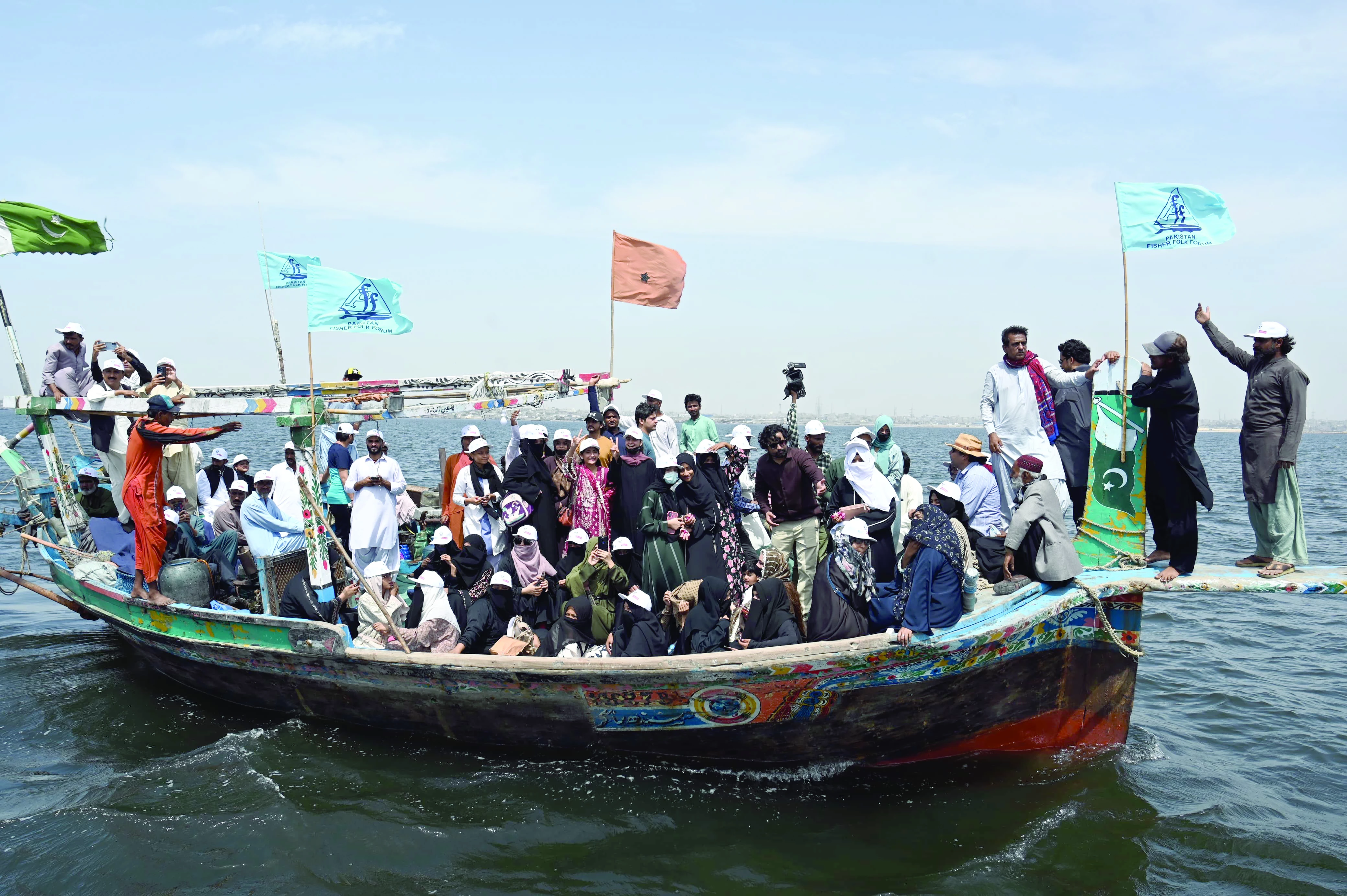 fisherfolk forum activists stage a protest on a boat against the proposed new canals on the indus river which they claim would damage the coastal ecosystem photo express fisherfolk forum activists stage a protest on a boat against the proposed new canals on the indus river which they claim would damage the coastal ecosystem photo express