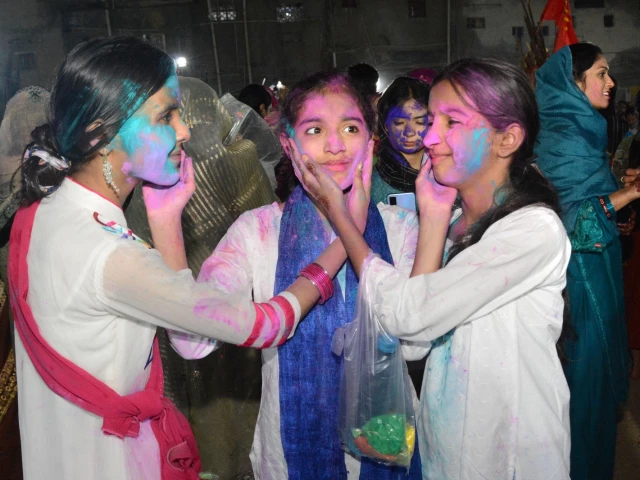 festival of colours young girls smear colour on each other as part of holi celebrations at the swaminarayan mandir in karachi photo express festival of colours young girls smear colour on each other as part of holi celebrations at the swaminarayan mandir in karachi photo express