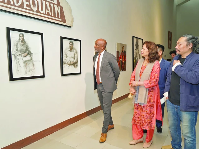 professor zhao yingming along with guests views his artworks following the inauguration of his exhibition at the pnca photo express professor zhao yingming along with guests views his artworks following the inauguration of his exhibition at the pnca photo express
