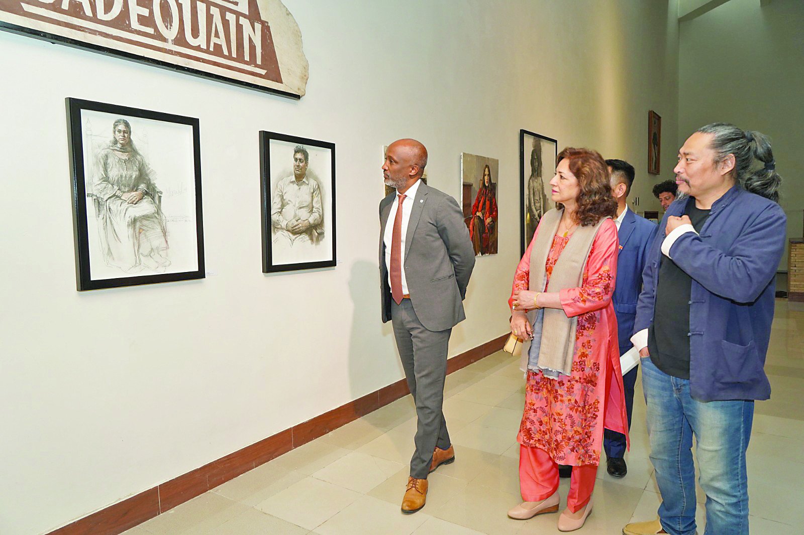 professor zhao yingming along with guests views his artworks following the inauguration of his exhibition at the pnca photo express