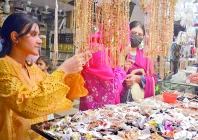women select accessories at a market in the city for the upcoming festive occasion of eidul fitr photo jalal qureshi express