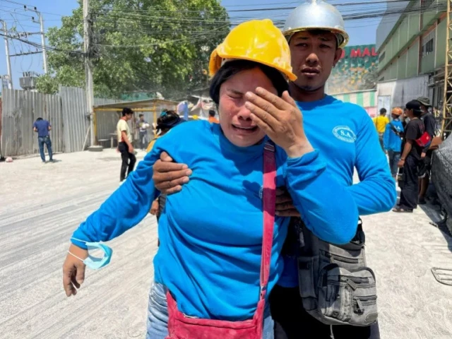 a worker reacts near a site of a collapsed building after the tremors of a strong earthquake that struck central myanmar affected bangkok thailand on march 28 2025 photo reuters