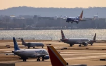 two american airlines jets bump wings on taxiway at washington airport