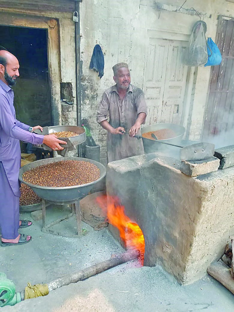 despite the international labour day holiday a worker continues his daily grind at a furnace roasting black chickpeas to support his family photo qaiser shirazi express despite the international labour day holiday a worker continues his daily grind at a furnace roasting black chickpeas to support his family photo qaiser shirazi express