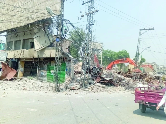 rawalpindi municipal corporation staff carry out the demolition of rose cinema using heavy machinery in raja bazaar rawalpindi photo express rawalpindi municipal corporation staff carry out the demolition of rose cinema using heavy machinery in raja bazaar rawalpindi photo express