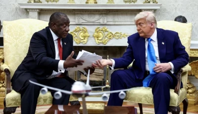 us president donald trump hands over to south african president cyril ramaphosa copies of articles that he said showed white south africans who had been killed in the oval office of the white house in washington dc us on may 21 2025 photo reuters