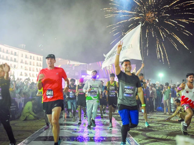 participants celebrate as they reach the finish line of islamabad night run photo courtesy organisers participants celebrate as they reach the finish line of islamabad night run photo courtesy organisers