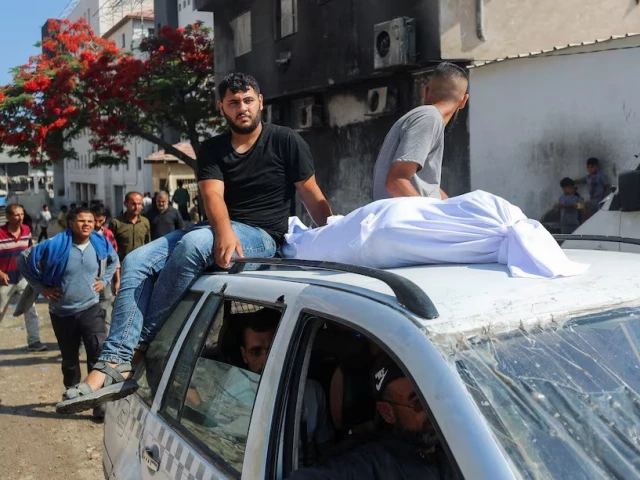 the body of a palestinian is transported on a car as mourners attend the funeral of palestinians who were killed according to medics in israeli fire at al shifa hospital in gaza city june 12 2025 photo reuters the body of a palestinian is transported on a car as mourners attend the funeral of palestinians who were killed according to medics in israeli fire at al shifa hospital in gaza city june 12 2025 photo reuters