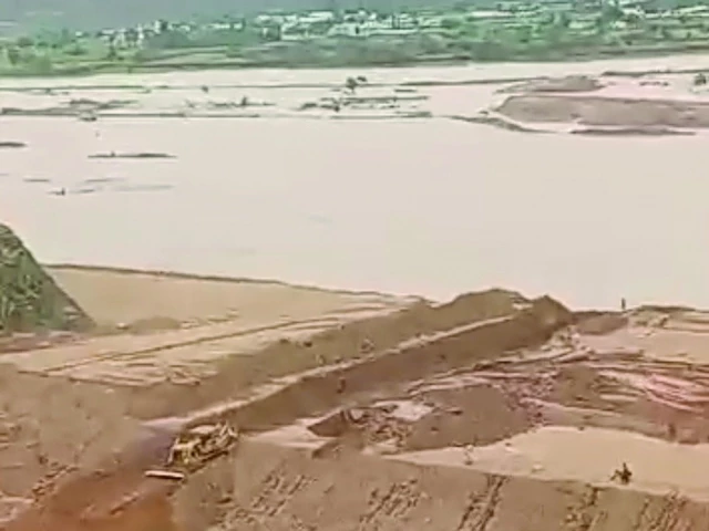 authorities make a controlled breach to release accumulated water from the dadocha dam s catchment area reducing the immediate threat of a larger flood photo express authorities make a controlled breach to release accumulated water from the dadocha dam s catchment area reducing the immediate threat of a larger flood photo express