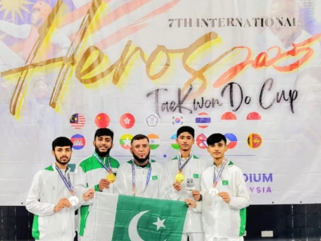 the karachi taekwondo academy team raising green flag high at the international taekwondo cup the karachi taekwondo academy team raising green flag high at the international taekwondo cup