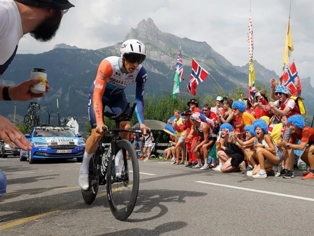 caption michael woods in action during stage 16 as spectators cheer photo reuters