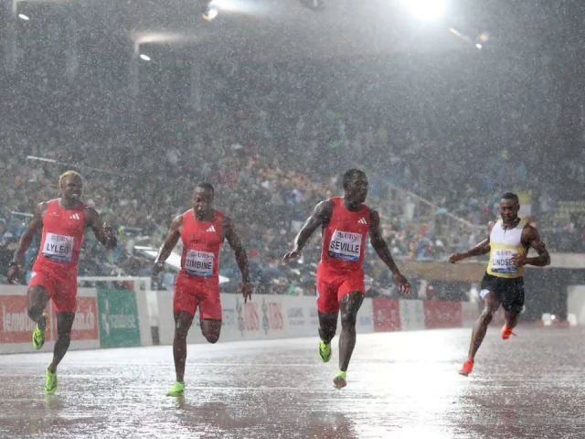 caption noah lyles is beaten by jamaica s oblique seville in the men s 100m photo afp