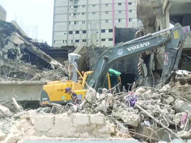 heavy machinery on friday clears the rubble of a building on ma jinnah road which collapsed after a fireworks warehouse in its basement exploded on thursday night photo epxress heavy machinery on friday clears the rubble of a building on ma jinnah road which collapsed after a fireworks warehouse in its basement exploded on thursday night photo epxress