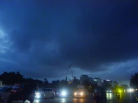when dusk meets monsoon the sky broods in deep greys a canvas for the dreamers but chaos for commuters clouds promise rain and poetry but in karachi the verses come soaked in struggle wearing the face of a traffic jam photo jalal qureshi express