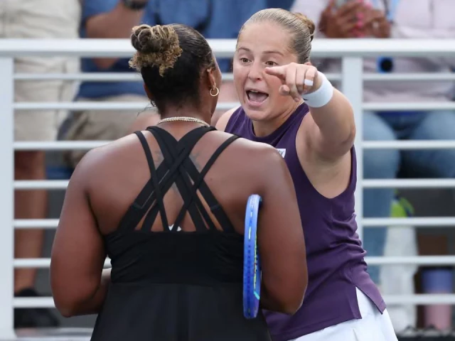 jelena ostapenko and taylor townsend exchange words at the net photo afp jelena ostapenko and taylor townsend exchange words at the net photo afp