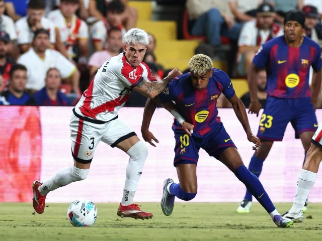 barcelona s lamine yamal in action with rayo vallecano s pep chavarria photo reuters barcelona s lamine yamal in action with rayo vallecano s pep chavarria photo reuters