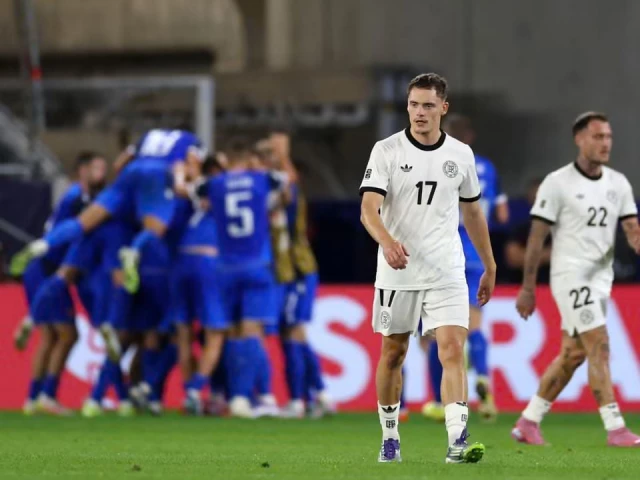 florian wirtz looks dismayed as slovakia celebrate their second goal in the shock 2 0 win over germany photo afp florian wirtz looks dismayed as slovakia celebrate their second goal in the shock 2 0 win over germany photo afp