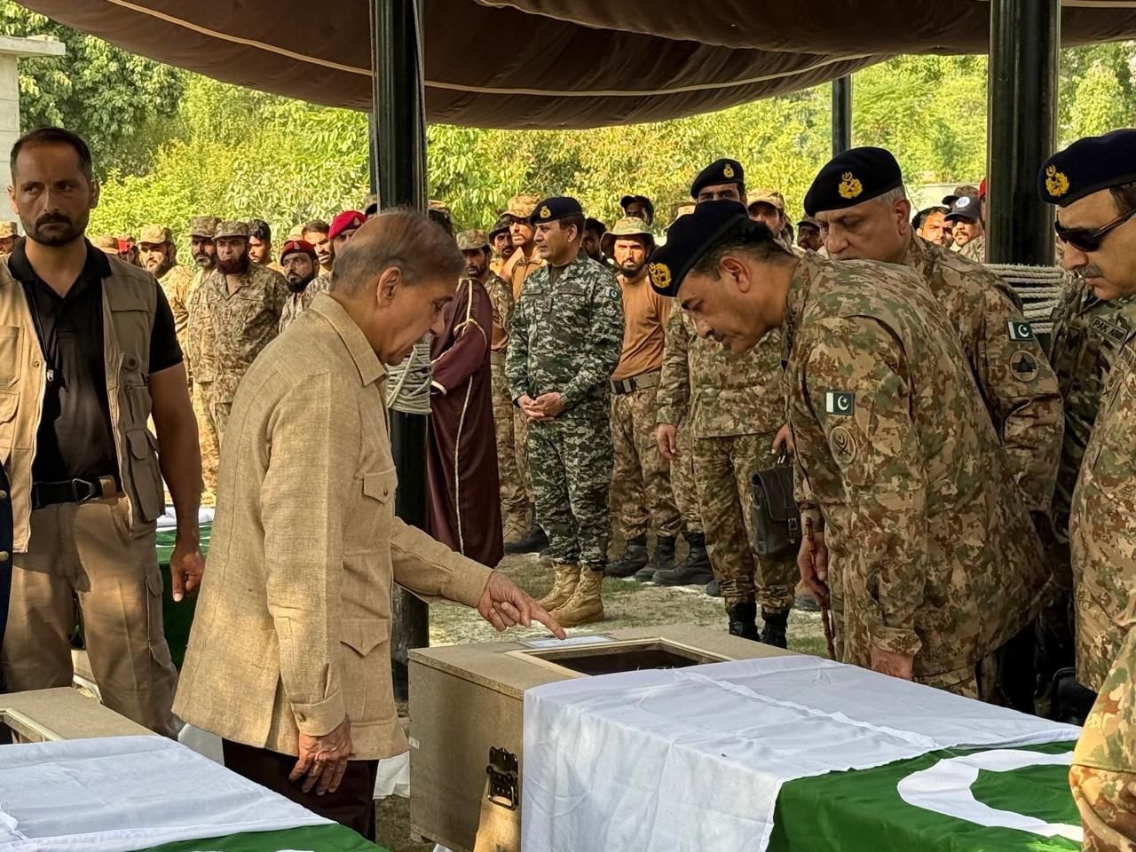 PM Shehbaz and COAS Asim Munir attend funeral of martyred soldiers in Bannu. (Photo Courtesy: PTV News via X)