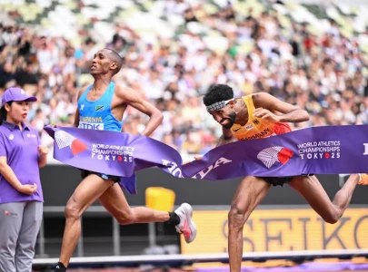 first ever tanzanian gold as simbu dips past petros in world marathon