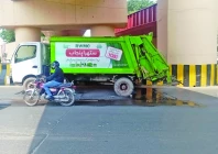 a vehicle belonging to the rawalpindi waste management company rwmc is found parked on a main road the vehicle is leaking oil spilling foul smelling wastewater and carrying waste in excess of its designated capacity photo express