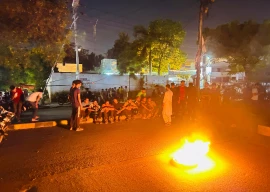 karachi university students torch tyres demand arrests after campus violence karachi university students torch tyres demand arrests after campus violence