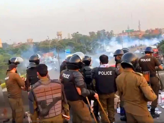 police tlp workers clash paralyzes life in lahore on friday screengrab from express footage police tlp workers clash paralyzes life in lahore on friday screengrab from express footage