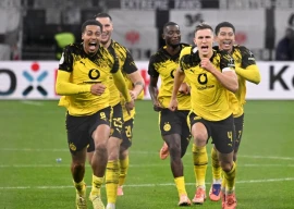 borussia dortmund players celebrate after knocking eintracht frankfurt out of the german cup on penalties photo afp