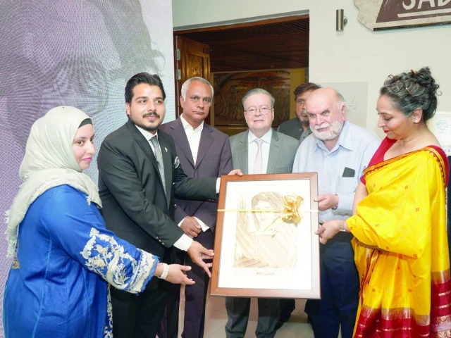 ambassador of france to pakistan nicolas galey receives a framed lithograph of the stranger by sadequain during the exhibition s opening at the pakistan national council of the arts islamabad photo express ambassador of france to pakistan nicolas galey receives a framed lithograph of the stranger by sadequain during the exhibition s opening at the pakistan national council of the arts islamabad photo express