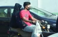 a biker though without helmet wears a mask on a dusty and windy day in the port city on wednesday photo jalal qureshi express